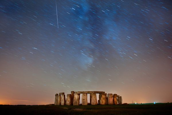 A Perseid meteor is seen during their annual spectacle above the Stonehenge monument on Salisbury Plain in southern England.