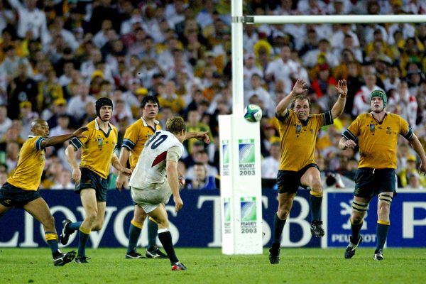 England's Jonny Wilkinson kicks a drop goal to win the Rugby World Cup final between Australia and England at the Olympic Stadium in Sydney in this November 22, 2003 file photo. Wilkinson, on his wrong foot, landed the drop goal that secured England's first World Cup and ended the Tri-Nations' stranglehold of rugby's ultimate prize. Picture taken November 22, 2003.   To match feature (SPORT) -DECADE/RUGBY  REUTERS/Kieran Doherty   (AUSTRALIA)